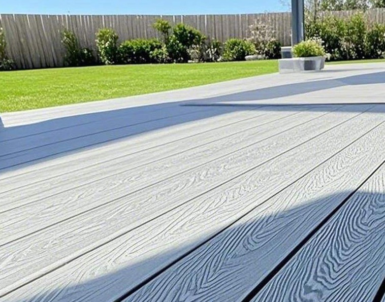 Silver Sylvan composite decking with a 3D wood-grain finish in a Devon back garden